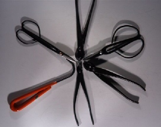 Set Includes 6 Tools A. - Satsuki Shears #1068.Made in China. Long narrow body which is great for trimming buds and reaching deep with minimum disturbance to the surrounding foliage. It's finger rings are also well suited for smaller hands. 3/4" blades, 7" overall. $14.95 each. Buy separately.  B. - Concave Branch Cutter #1070. (Beginner) This razor sharp tool is designed for cutting branches flush to the trunk. The resulting wound can then heal over quickly with very little scarring. Will keep a sharp edge indefinitely when properly used and cared for. The Concave Cutter is the single most important tool for bonsai use and for which there is no substitute. The 8" version is considered the basic size. 8" overall. Similar in appearance to above. Made in China. $23.95 each. Buy separately.   C. - Bonsai Wire Cutters #1071. Made in China. These wire cutters are designed specifically for removing bonsai wire. Although enthusiasts new to bonsai sometimes substitute standard wire cutters, t