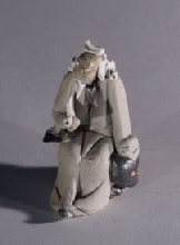 unknown Ceramic Figurine  - Man With Pipe<br>1.5 x 1.5 x 2.5