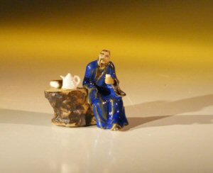 unknown Ceramic Figurine - Man Sitting at Table