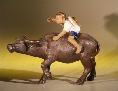 unknown Miniature Ceramic Figurine <br>Boy Riding Buffalo