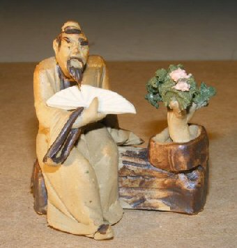 unknown Ceramic Figurine: Man with Bonsai Tree Holding a Fan<br><i>Measures 2.0 x 2.5 Tall</i>