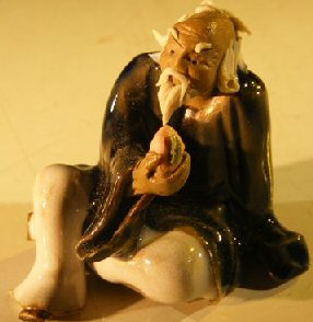 unknown Miniature Figurine: Man Eating a Peach<br><i></i> Blue and White Color- Fine Detail