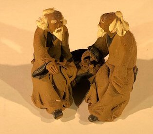 human miniature ceramic statue