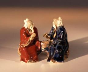 Glazed Miniature Figurine<br>Two Men Sitting at Chess Table