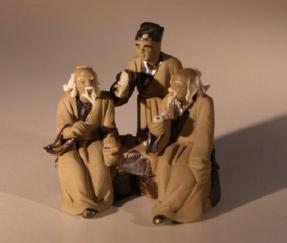 Unglazed Miniature Mud Figurine<br>Three Men Sitting at Chess Table       