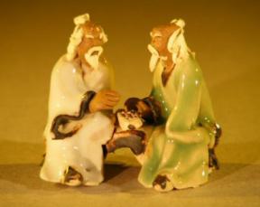 Miniature Ceramic Figurine<br>Two Men Sitting at a Table with Fine Detail<br>Color: White & Green