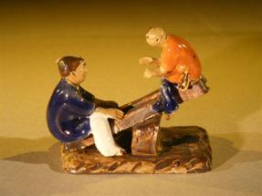 Ceramic Figurine<br>Two Boys on a See-Saw