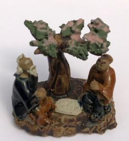 Miniature Ceramic Figurine<br> Two Men Sitting at a Table Under a Tree <br>Blue & Brown Color