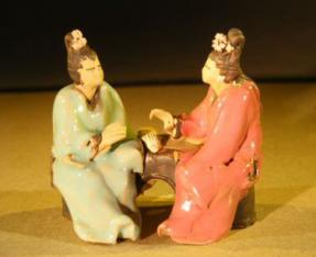 Miniature Ceramic Figurine<br>Two Women Sitting at a Table<br> Color: Red & Green