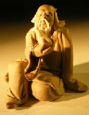 Ceramic Figurine- Man with Pipe. 1.5