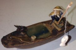 Ceramic Figurine<br>Fisherman On A Boat Fishing With Duck