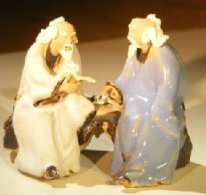 Miniature Glazed Figurine<br>Two Men Sitting on a Bench Reading Books<br>Color: White & Light Blue