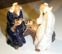 Miniature Glazed Figurine<br>Two Men Sitting on a Bench Reading Books<br>Color: Blue & White