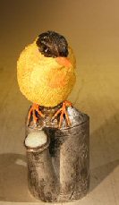 Miniature Bird Figurine<br><i></i>Sitting Atop A Watering Can<br>