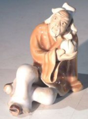 Ceramic Figure - Man Holding Fruit<br>1.5