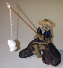 Ceramic Figurine<br>Fisherman Sitting On A Log<br>Small Size