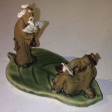 Miniature Ceramic Figurine <br>Two Mud Men On A Leaf, One Standing Holding a Fan, Other Sitting Reading a Book - 2