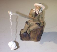 Ceramic Figurine<br>Mud Man Sitting On A Rock Fishing<br>Small Size
