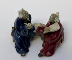 Ceramic Figurine<br>Two Men Sitting On A Bench Holding Fan & Pipe- 2.0