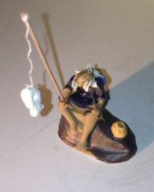 Ceramic Figurine<br>Fisherman Sitting On A Rock<br>Small Size 