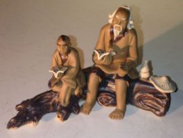 Ceramic Figurine<br>Father & Son Mudmen<br>Sitting On A Log Reading