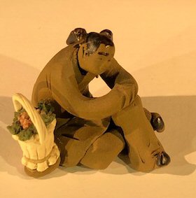 Ceramic Figurine<br> Mud Man Sitting With Basket Of Flowers - 2