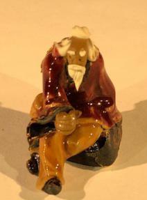 Miniature Ceramic Figurine<br><i></i>Man Sitting on Bench<br>2