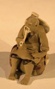 Miniature Ceramic Figurine - Mud Man With Pipe<br>1.5