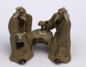 Ceramic Figurine<br>Two Mud Men Sitting On A Bench Reading Book<br>2