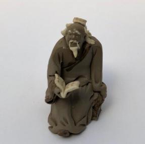 Ceramic Figurine<br>Mud Man Reading Book - 2