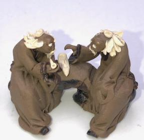Miniature Ceramic Figurine<br>Two Mud Men Sitting on a Bench Playing Music- 1.5